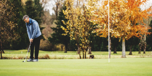 Man putting at Maplewood Golf Course in Renton.
