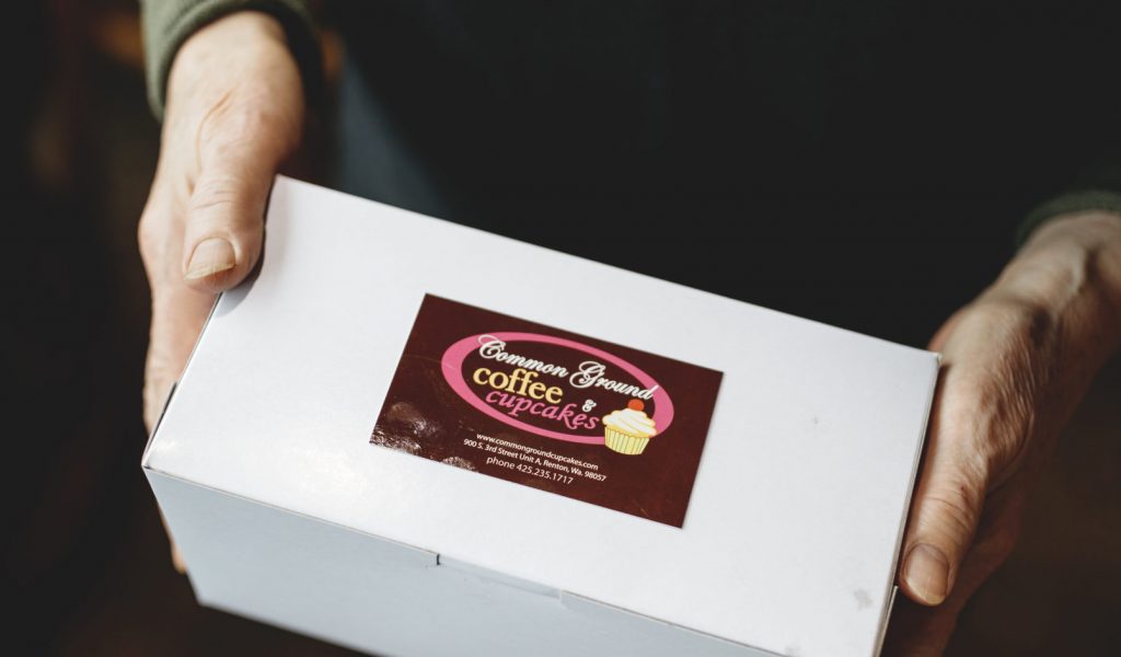 Common Ground Coffee & Cupcakes in Renton, WA What’s in the box? Treats and smiles fill Common Ground to-go orders.