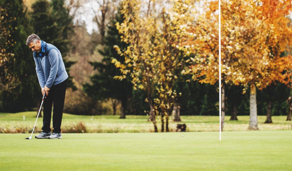 Maplewood Golf Course Man putting at Maplewood Golf Course in Renton.