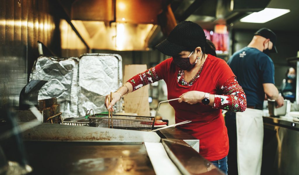Chef at Saimin Says in Renton WA Chef Co cooking a meal at Saimin Says in Renton, WA>